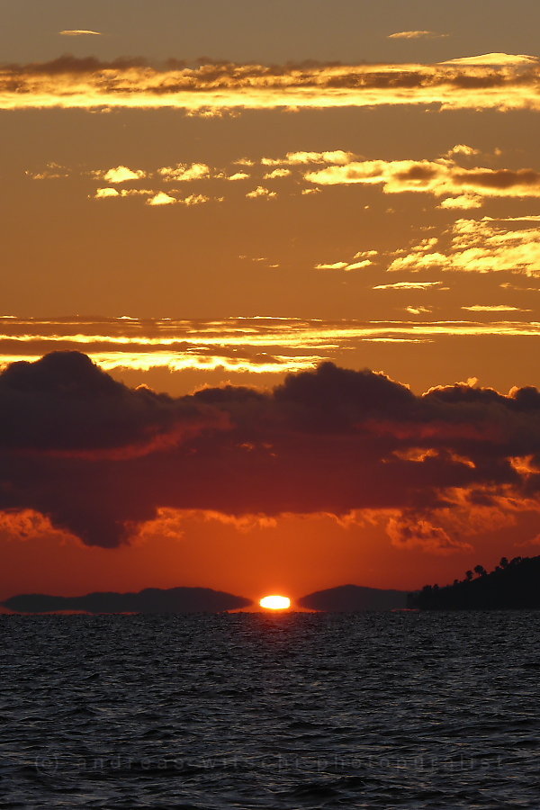 Mirage And Rising Sun Over Lake Titicaca